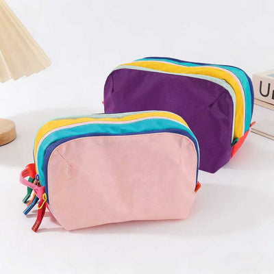 Dopamine Color-Blocking Cosmetic Bag, waterproof with large capacity, layered storage for skincare and makeup, easy opening and closing with drawstring zipper, essential sweet storage item for travel and commuting./(front) light powder (back) deep purple